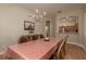 Dining room with wood floors, chandelier and easy access to the kitchen, ideal for entertaining guests at 4605 Casswell Dr, New Port Richey, FL 34652