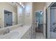 This bathroom features double sinks and access to two rooms at 4612 River Overlook Dr, Valrico, FL 33596