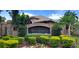 Entrance to the estates at River Crossing offers a welcoming view of lush landscaping and manicured greenery at 4612 River Overlook Dr, Valrico, FL 33596