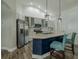 Modern kitchen with stainless steel appliances, granite countertops, and a large island at 4612 River Overlook Dr, Valrico, FL 33596