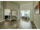 Bright living room with wood flooring, neutral walls, and slider to patio and pool at 4612 River Overlook Dr, Valrico, FL 33596