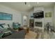 Cozy living room with fireplace, TV, and comfortable seating arrangements at 4612 River Overlook Dr, Valrico, FL 33596