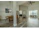 Spacious living room area showcasing wood flooring and view of dining and patio at 4612 River Overlook Dr, Valrico, FL 33596