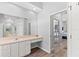 Bright bathroom with a vanity area and doorway to the main bedroom at 490 Knight Dr, Tarpon Springs, FL 34688