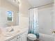 Cozy bathroom with a shower-tub combo and white vanity at 490 Knight Dr, Tarpon Springs, FL 34688