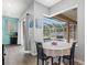 Bright dining area offers views of the screened-in pool and covered patio at 490 Knight Dr, Tarpon Springs, FL 34688