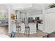 Kitchen featuring bar seating, white cabinets, stainless appliances, and eat-in area at 490 Knight Dr, Tarpon Springs, FL 34688
