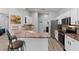 Well-lit kitchen featuring granite countertops, stainless steel appliances, and a breakfast bar at 490 Knight Dr, Tarpon Springs, FL 34688