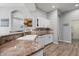 Well-lit kitchen features granite countertops, white cabinetry, and stainless steel dishwasher at 490 Knight Dr, Tarpon Springs, FL 34688