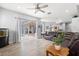 Spacious living room open to the kitchen, dining area, and screened-in pool at 490 Knight Dr, Tarpon Springs, FL 34688