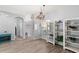 Bright and airy living room with wood floors, contemporary decor, and views into the front yard at 490 Knight Dr, Tarpon Springs, FL 34688