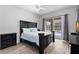 Spacious main bedroom with sliding glass doors to the screened-in pool at 490 Knight Dr, Tarpon Springs, FL 34688