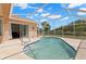 Beautiful screened-in pool area with an outdoor seating area at 490 Knight Dr, Tarpon Springs, FL 34688