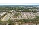 Aerial view of the neighborhood featuring a pond, landscaping and community pool at 5344 Sylvester Loop, Tampa, FL 33610