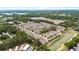 An aerial community view of the neighborhood, pond and surrounding trees at 5344 Sylvester Loop, Tampa, FL 33610