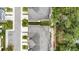 Aerial view of the home with landscaped yards, sidewalks, and street parking at 5344 Sylvester Loop, Tampa, FL 33610