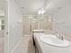 Bright bathroom showcasing dual sinks, a vanity, and a glass shower at 5344 Sylvester Loop, Tampa, FL 33610