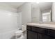 Bathroom featuring a vanity, toilet, and a shower-tub combo with tiled walls at 5344 Sylvester Loop, Tampa, FL 33610