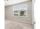 Bedroom features a window with blinds and natural light at 5344 Sylvester Loop, Tampa, FL 33610