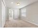 Neutral bedroom with carpet flooring, closet doors, with a window offering natural light at 5344 Sylvester Loop, Tampa, FL 33610