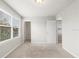 Bedroom has a window and a door leading to another room at 5344 Sylvester Loop, Tampa, FL 33610
