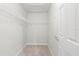Walk-in closet with built-in shelving and neutral carpeting at 5344 Sylvester Loop, Tampa, FL 33610