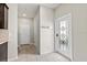 Bright entryway featuring decorative glass door and tile flooring leading to the staircase at 5344 Sylvester Loop, Tampa, FL 33610
