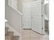 Bright entryway featuring tile flooring, neutral walls, and staircase leading to the upper level at 5344 Sylvester Loop, Tampa, FL 33610