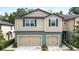 Charming two-story townhome featuring dual garages and well-maintained landscaping at 5344 Sylvester Loop, Tampa, FL 33610