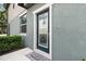 Front entrance featuring a decorative glass door and a 'Hello' welcome mat at 5344 Sylvester Loop, Tampa, FL 33610