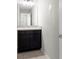 Half bathroom features tile flooring, and a vanity at 5344 Sylvester Loop, Tampa, FL 33610