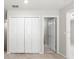 Hallway view of closets and an open door leading to another room at 5344 Sylvester Loop, Tampa, FL 33610