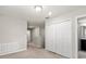 Hallway features carpet floors and a view into the bathroom at 5344 Sylvester Loop, Tampa, FL 33610