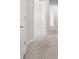 Light hallway with a carpeted floor and a view into a room at 5344 Sylvester Loop, Tampa, FL 33610