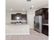Modern kitchen featuring stainless steel appliances and dark cabinets at 5344 Sylvester Loop, Tampa, FL 33610