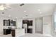 Open kitchen with stainless appliances, dark cabinets, and central island at 5344 Sylvester Loop, Tampa, FL 33610