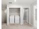 Upper level laundry closet with washer and dryer at 5344 Sylvester Loop, Tampa, FL 33610