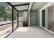 Screened patio with concrete floor, exterior fan, and views of the backyard at 5344 Sylvester Loop, Tampa, FL 33610