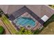 Aerial view of a screened pool and patio area in a private backyard setting at 5507 Keeler Oak St, Lithia, FL 33547