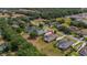 Aerial view showcasing the residential landscape and neighborhood layout with ponds and mature trees at 5507 Keeler Oak St, Lithia, FL 33547