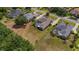 Aerial view showcasing the property with a screened pool, spacious yard and neighboring homes at 5507 Keeler Oak St, Lithia, FL 33547