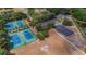 Community aerial view showcasing the tennis courts, basketball court, and sports field at 5507 Keeler Oak St, Lithia, FL 33547