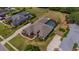 Expansive aerial view of a single-Gathering home with a screened pool, well-manicured landscaping and spacious backyard at 5507 Keeler Oak St, Lithia, FL 33547