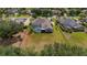 An aerial of a home with a large backyard, screen enclosed pool, and well kept landscaping at 5507 Keeler Oak St, Lithia, FL 33547