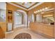 Elegant bathroom with dual sinks, recessed lighting, and a separate tub with a picturesque window at 5507 Keeler Oak St, Lithia, FL 33547