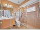 The bathroom features a tiled walk-in shower, matching fixtures, and a spacious vanity at 5507 Keeler Oak St, Lithia, FL 33547
