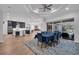 Elegant dining area with modern lighting and stylish furnishings, adjacent to the kitchen at 5507 Keeler Oak St, Lithia, FL 33547