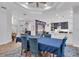 Chic dining room with modern décor seamlessly connected to the well-equipped kitchen area at 5507 Keeler Oak St, Lithia, FL 33547