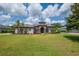 Stunning single-story home with lush front yard and elegant architectural details at 5507 Keeler Oak St, Lithia, FL 33547