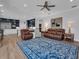 Open-concept living room with hardwood floors connecting the kitchen, offering great flow at 5507 Keeler Oak St, Lithia, FL 33547